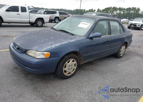 2000 Toyota Corolla Le z USA, uszkodzony, nr VIN 2T1BR12EXYC297082